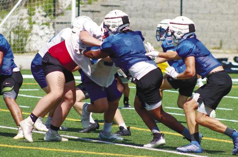 Lake Oconee Academy defenders tackle an Oglethorpe County ball carrier in last week’s padded camp at Titan Stadium. LANCE McCURLEY/Staff