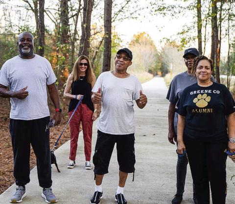 A group of pedestrians enjoys a walk on the Firefly Trail. CONTRIBUTED