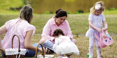 Pretty in pink. One of the Uncle Remus Golf Course ponds provided a perfect Easter backdrop for a family gathering during Saturday’s inaugural Leadership Putnam Easter Egg Hunt. IAN TOCHER/Staff