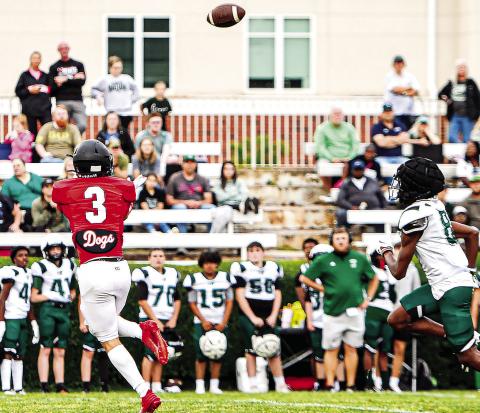 Morgan County wide receiver Dallas Dickerson (3) tracks a ball in the open field past a Walnut Grove defensive back. CHARLES JORDAN/Staff