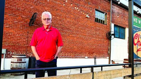 Ken McCord in front of the former Oconee Brewing Company, now being launched as Barrel & Rail. MAUREEN STRATTON/Staff