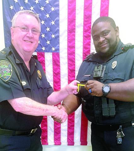 Interim Chief Roy Whitehead and Police Officer Jonathan Mills who was recently promoted to senior police officer. CONTRIBUTED