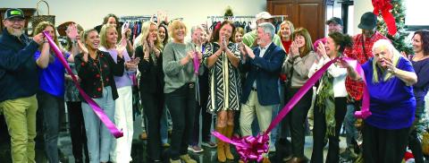 Well-wishers cheer as the ribbon falls to officially open Second Chance Boutique at 939 Greensboro Rd., Eatonton. Proceeds from the upscale thrift store will benefit Circle of Love, a long-running domestic violence shelter in Greene County. IAN TOCHER/Staff