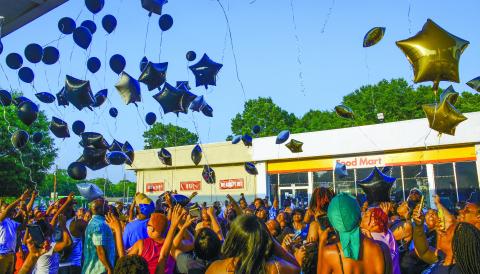 More than 100 people gathered to release memorial balloons last Friday night outside a Shell station in Eatonton where Frederick Scott Jr. was murdered June 4, in a broad-daylight shooting.