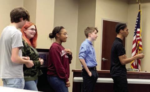 PCHS students Ty Young, Hunter Cousino, Taylor Wilson, Aidan Brock and Cameron Lawson tell the board about their experiences at the conference. BAILEY BALLARD/Staff