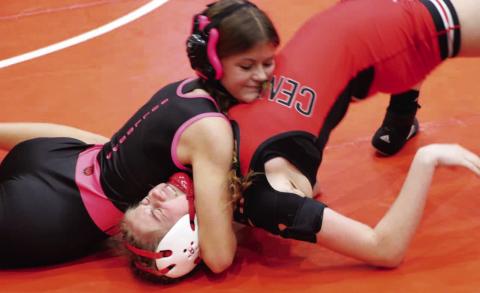 Morgan County’s Airyanna Klinger (left) works for a pin during a match earlier this season. Klinger placed sixth in her weight class at last week’s state traditional meet, becoming the first female wrestler in program history to do so. JATAVIOUS WARD/Contributed