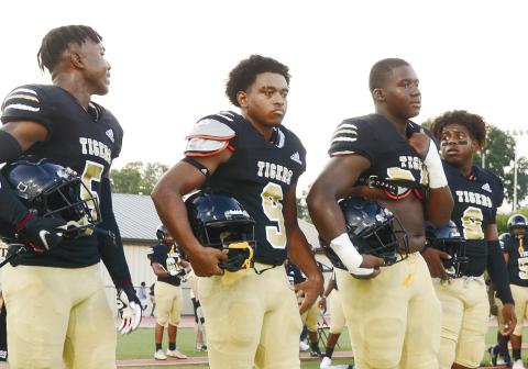 Arkiyus Wright (5, very left) and Malik West (8, very right) we’re two of the team’s captains for their scrimmage game against Putnam County. BRENDAN KOERNER/Staff