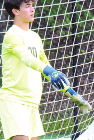 Freshman goalkeeper Knox van Mol (00) getting ready to take a goal-kick in the Final Four of the state playoffs. BRENDAN KOERNER/S t a ff