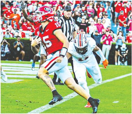 Georgia quarterback Carson Beck (15) easily finds the end zone on a 4-yard touchdown scramble against the Skyhawks. CHARLES JORDAN/Contributed