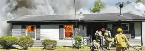Although firefighters had this fire in Woodville under control in 10 minutes, the home was a total loss. (Photo contributed from Greene County Emergency Services)