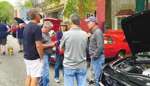 Car enthusiasts talk about – well, cars – at this year’s Southland Jubilee, which came back to Greensboro after a pandemic hiatus.