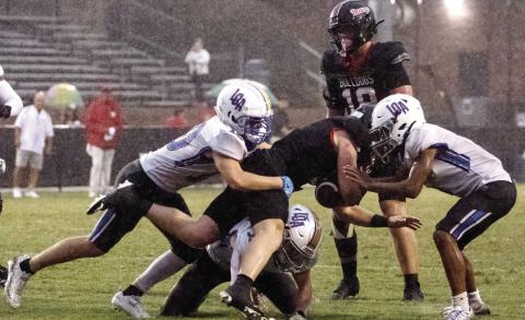 A pair of LOA defenders bring down a GWA ball carrier. SKYLA MORRIS/Staff
