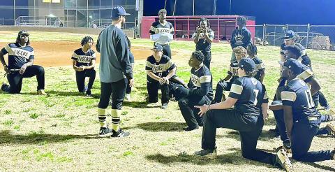 Greene County baseball head coach Brad Evans talks to the team after its close loss to Cross Creek on Feb. 14. CONTRIBUTED
