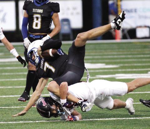 LOA quarterback Ike O'Neal (7) dives for a first down in a 21-3 win over George Walton Academy last Friday. (WILL MORRISON/Staff)