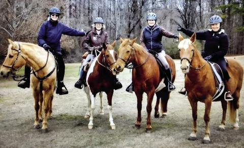 Kel-Mac Saddle Club members (l-r) Lori Williams, Jeanne Barsanti, Dayle Faulkner, and Susan McCullar briefly pose for a photo during a ride together. CONTRIBUTED