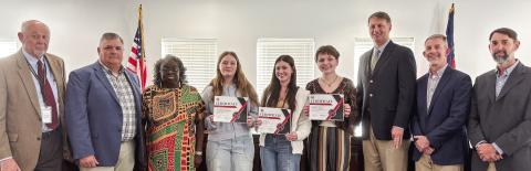 State literary girls’ trio runners-up (at center, l-r) Annabel Sparrow, Sora Rose, and Aaron Cooper are recognized by the Morgan County Board of Education. HANNAH BARRON/Staff