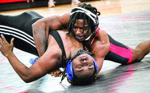 Morgan County wrestler Braxton Jones attempts to pin a Burke County opponent during the Area 4-AA duals meet. JATAVIOUS WARD/Contributed