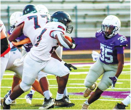 Senior running back Jacere Cooper (24) evades a defender during Morgan County’s scrimmage with Cherokee Blu_. LANCE McCURLEY/Staff