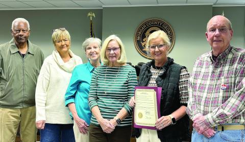 The Morgan County contingent of the Georgia Retired Educators Association receives a proclamation from the Morgan County Board of Commissioners designating Nov. 3 as Retired Educators Day. Pictured with the contingent during the BOC’s Oct. 15 meeting are District 1 commissioner and retired educator Donald Harris (far left) and board chairman Bill Kurtz (far right). HANNAH BARRON/Staff