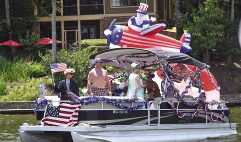 The Massey family, of Morgan County, was awarded the Most Patriotic vessel at the sixth-annual Lake Oconee boat parade. T. MICHAEL STONE/Staff