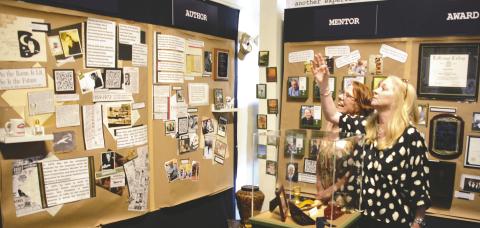 Terry Kay’s youngest daughter, Heather (right), shares a moment with Susan Smyth as they look over the artifacts of Kay’s life displayed in a new exhibit opening this Thursday at the Georgia Writers Museum in Eatonton.