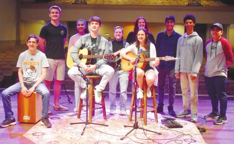 All performers and sound crew, for the third coffee house, came together to sing and close out the night. BAILEY BALLARD/Staff