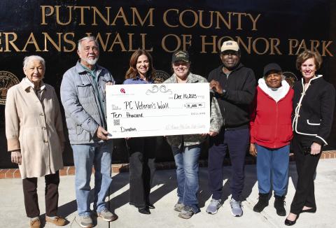 L-R: Talethia and Randy McMichael joined 100 Women Who Care Lake Country Director Rebecca Prance and Veterans Wall of Honor Park administrator Nikki Barker, with Rev. Sidney Jackson, his wife, Lula, and 100WWCLC member Nancy Marshall, as the charitable organization made a $10K donation to support the downtown Eatonton park. IAN TOCHER/Staff