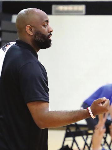Despite taking the GCHS athletic director position, Williams (left) plans to coach the Lady Tigers next season. FILE PHOTO