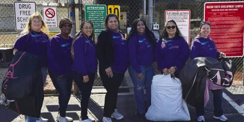 Reasha Daniels (third from right) and several other Putnam County women recently visited a youth detention center for girls in Macon to distribute dresses for a Valentine’s Day dance. CONTRIBUTED