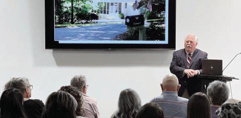 With a photo of the Dermonds’ Great Waters home on the TV mounted behind him, Putnam County Sheriff Howard Sills presents the evidence gathered so far in what he admits is the “toughest case” of his career so far. IAN TOCHER/Staff