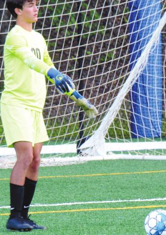 Freshman keeper Knox van Mol (00) directing teammates to set up a deep ball down the pitch. BRENDAN KOERNER/Staff