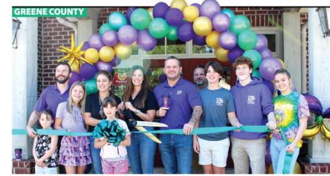 The Millwood and McClendon families celebrated the ribbon-cutting ceremony at PJ’s Coffee during the open house event May 16. The Greene County Chamber of Commerce held the event to welcome the families to the local business community. SKYLA MORRIS/Staff