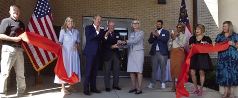 The Georgia Department of Veterans Service hosted a ribbon cutting, with keynote speaker Gov. Brian Kemp (third from left) and his wife, Georgia First Lady Marty Kemp (second form left), to celebrate the opening of the Transitional Support Unit. BAILEY BALLARD/Staff