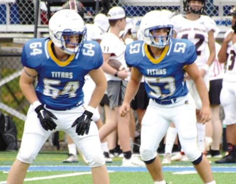 Titans stomp Walker for first win. BRENDAN KOERNER/Staff