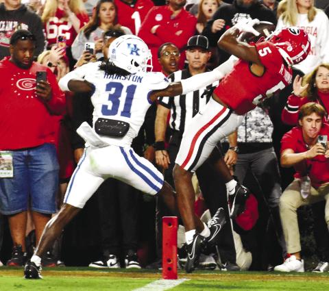 Wide receiver Rara Thomas (5) catches a touchdown pass over a Kentucky defender for Georgia’s second score of the night. BRENDAN KOERNER/Staff