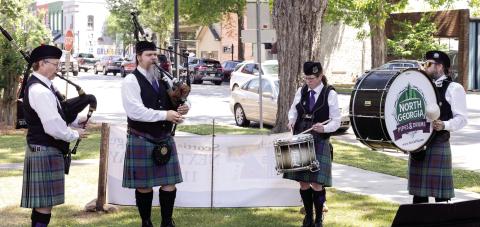 Bagpipers and drummers play outside as attendees arrive to First Presbyterian Church in Greensboro for Scottish Heritage Day. LEIGH LOFGREN/Staff