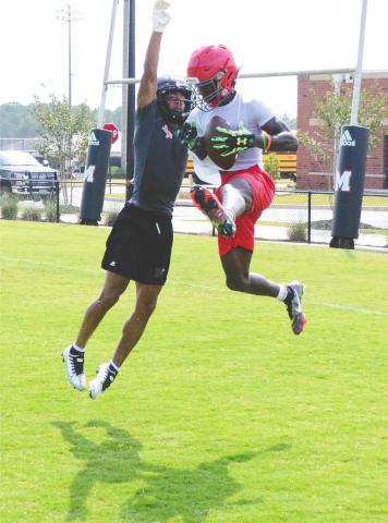 A Morgan County cornerback going up to make a play on an opposing wide receiver in the endzone during a 7-on-7 scrimmage against Loganville High School. BRENDAN KOERNER/Staff