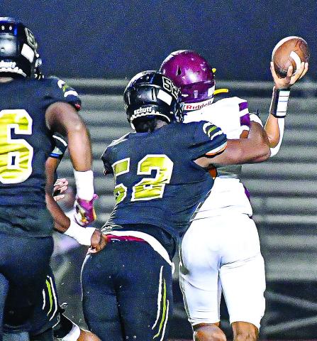 Defensive end Dayshawn Copeland (52) sacks Hancock Central’s quarterback for one of the Tigers’ many tackles-for-loss in last Friday’s contest. CHARLES JORDAN/Staff