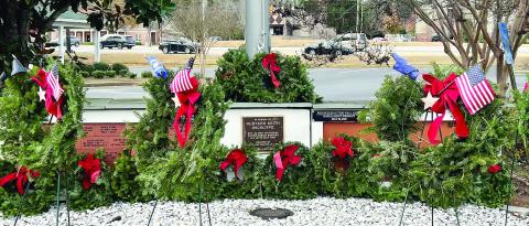 Wreaths in front of the Lake Oconee Lodge Veterans Wall.