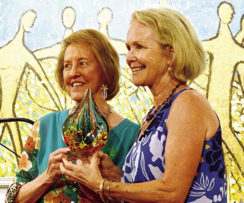 Retired MCMS art teacher Marjean Meadow (right) received a Charlie Bonner Award for Advancing Art Education from Lisa Thomas Conner. (IAN TOCHER/Staff)