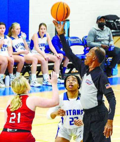 Senior point guard Jada Williams (22) tipping off against a Social Circle defender in a game last year. Williams led the Titans in points last Tuesday. BRENDAN KOERNER/Staff