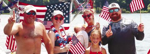 Patriotic displays of the Stars and Stripes dominated many entries in last year’s July 4th Boat Parade organized by Joe Williamson at the north end of Lake Oconee. LANCE McCURLEY/Staff