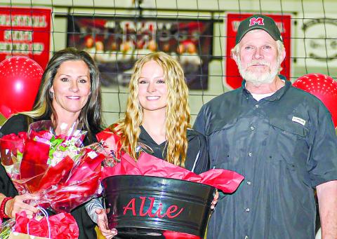 Allie Cox with her mother, Christy, and her father, Mercer, at Morgan County’s senior night game last week. CHARLES JORDAN/Staff