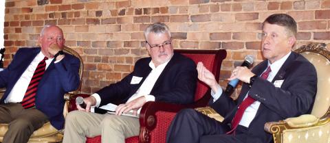 Former Georgia governor and current University System of Georgia Chancellor Dr. Sonny Perdue (left) participates in a fireside chat with Technical College System of Georgia Commissioner Greg Dozier (right), moderated by BankSouth CEO and USG Board of Regents Chair Harold Reynolds (center). HANNAH BARRON/Staff