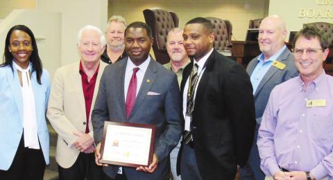 Greene County High School was honored as an Advanced Placement Honor School by the Georgia Department of Education. Front, from left: Assistant Superintendent Rotonya Rhodes, BOE Chair Mike Lynch, GCHS Principal James Peek, GCHS Athletic Director Eddie Hood and BOE member Perry Lee; back: School Board members Joe Bashore and Steve Kilgore and Superintendent Chris Houston. MARK ENGEL/Staff