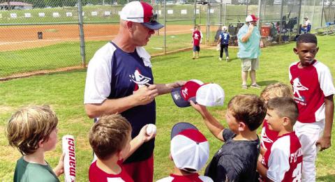 Former Braves pitcher Kevin Millwood signed hats, balls, and bats for several young Fisch Campers last Saturday at the Greene County Recreation Center. CONTRIBUTED
