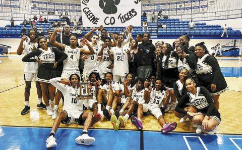The Greene County basketball team poses for a photo with cheerleaders after defeating Warren County 76-61 last Friday in Hiawassee to win the program’s first region championship in a decade. CONTRIBUTED