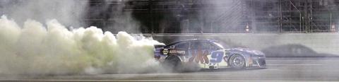 Chase Elliott celebrates Saturday night’s win at EchoPark Speedway with a burnout. BRAD HARRISON/Staff