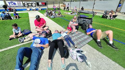 Parents and students turned out Monday for an eclipse watch party at LOA’s Tucker Field Monday. Above are the Dye, Parrish and Harris families.