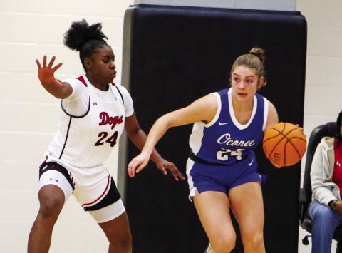 Morgan County’s Cydney Burke (left) guards Oconee County’s Lydia Gay (right) in a game earlier this season. LANCE McCURLEY/Staff